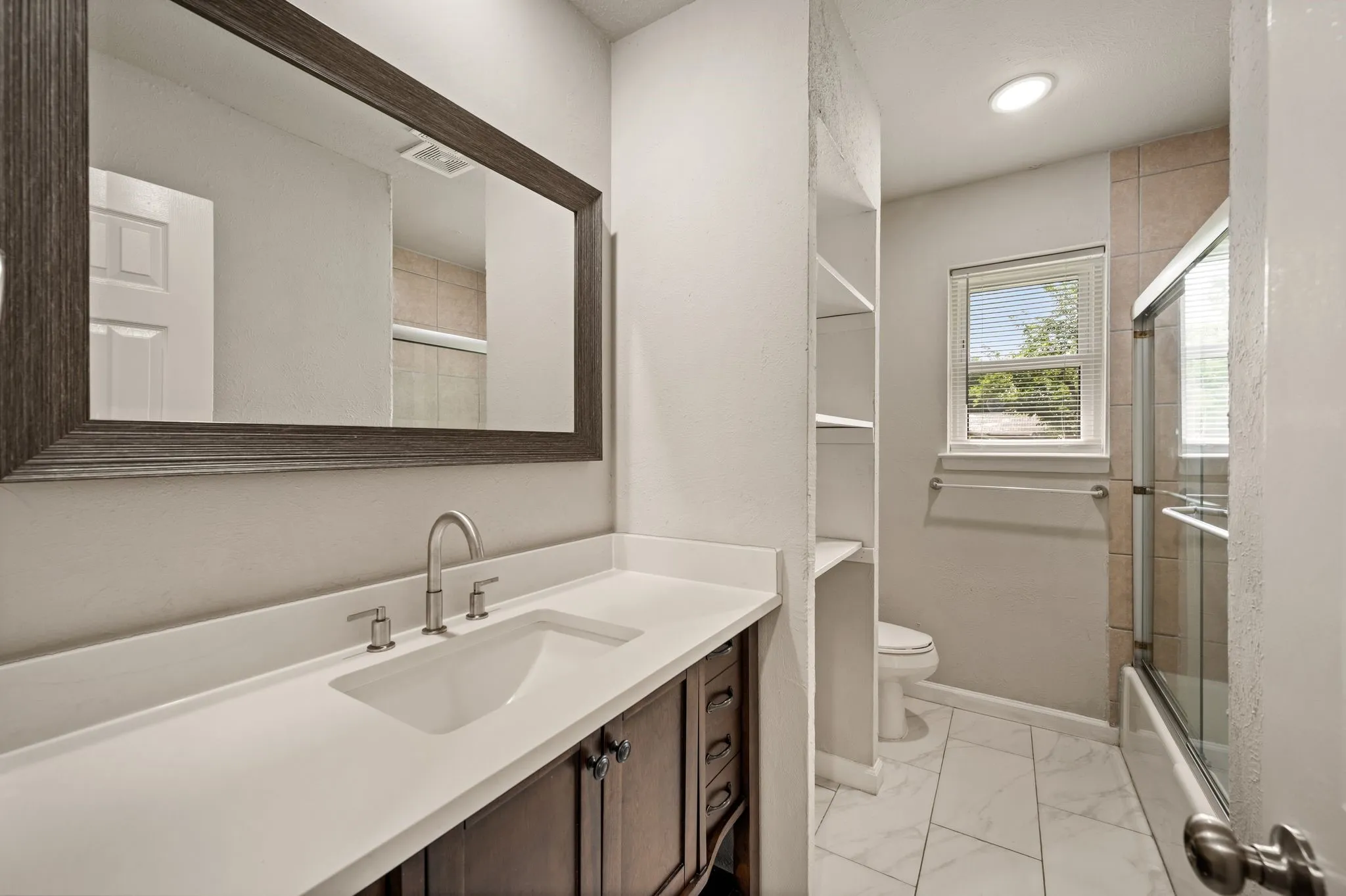 Furniture-style Vanity; Quartz countertop; Undermount sink; Updated fixtures; BIG Linen storage