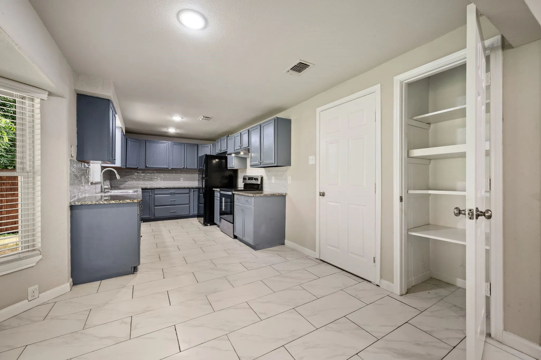 Dining is Open and connects Living to Kitchen; Pantry; Closed Door to right leads to Garage which has updated Washer plumbing and dryer Ventilation