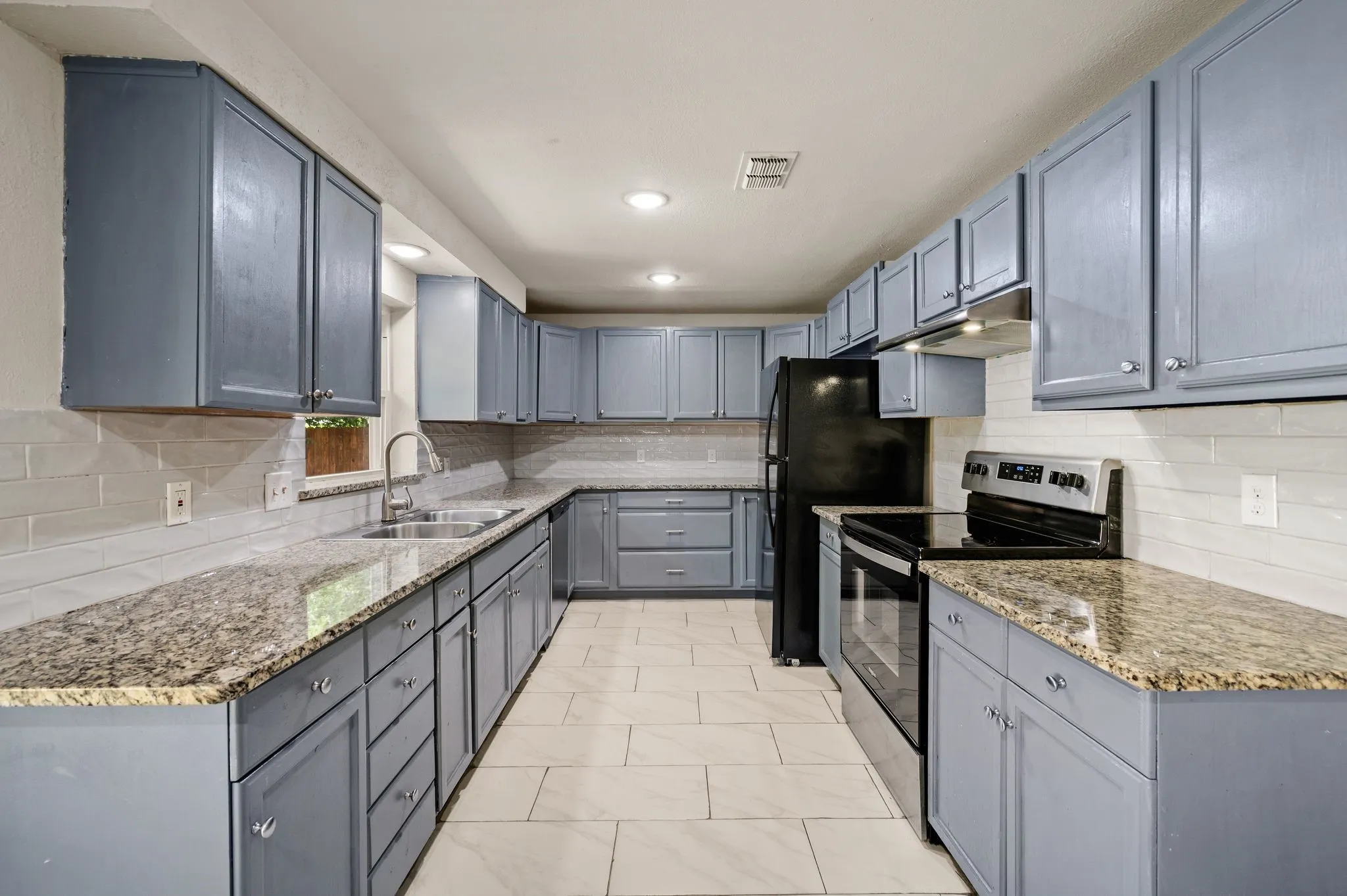 Granite counters; Bright White full tile Backsplash; Abundant Storage