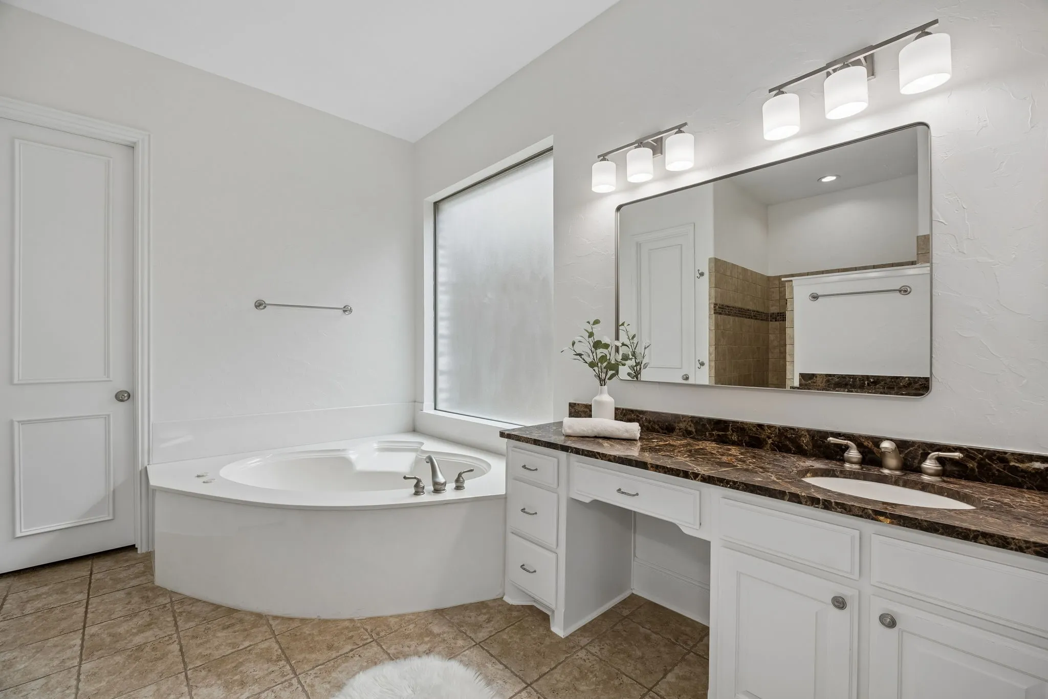 Large garden tub, vanity seating and an over-sized walk-in closet