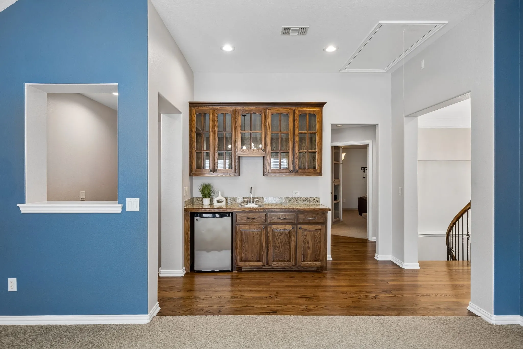 Upstairs wet bar services the game and media rooms.
