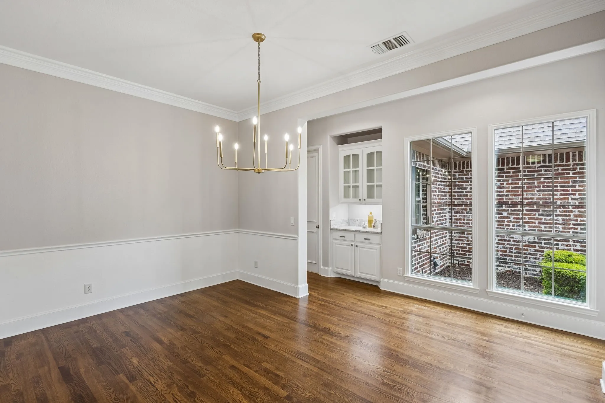 Dining room features a butler's pantry and plenty of sunlight