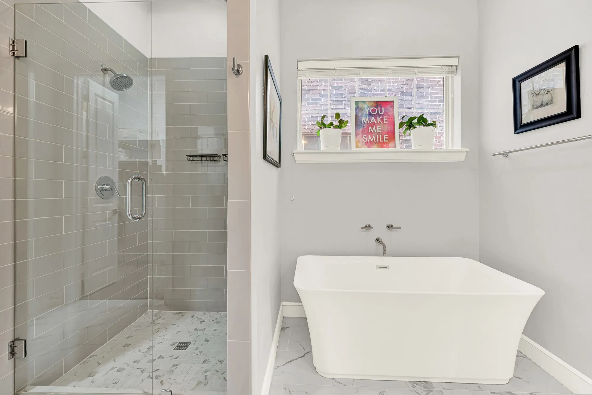 Freestanding soaking tub with wall-mounted fixtures