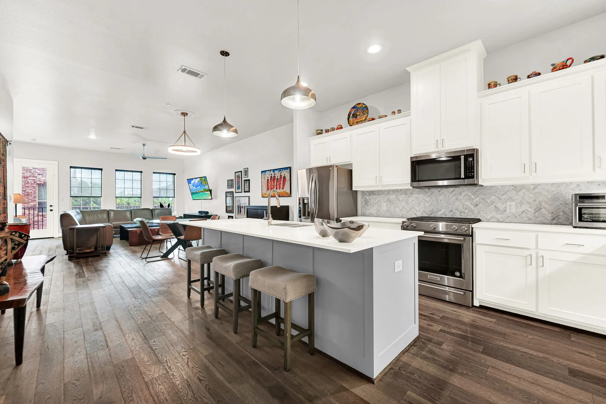 Open-concept living space featuring wood-finish flooring