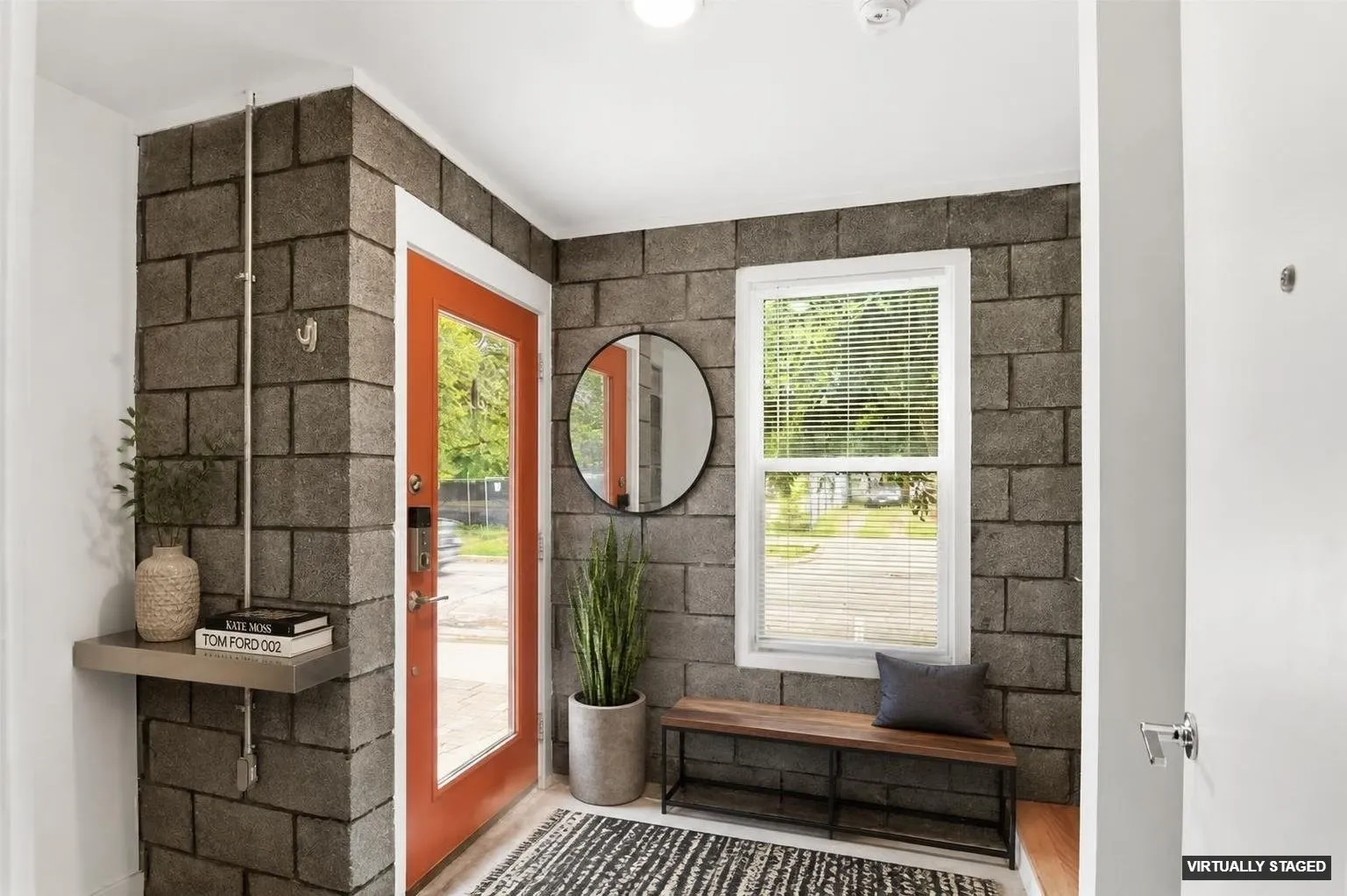 Exposed bricks in entrance foyer give the unit an urban-like feel.