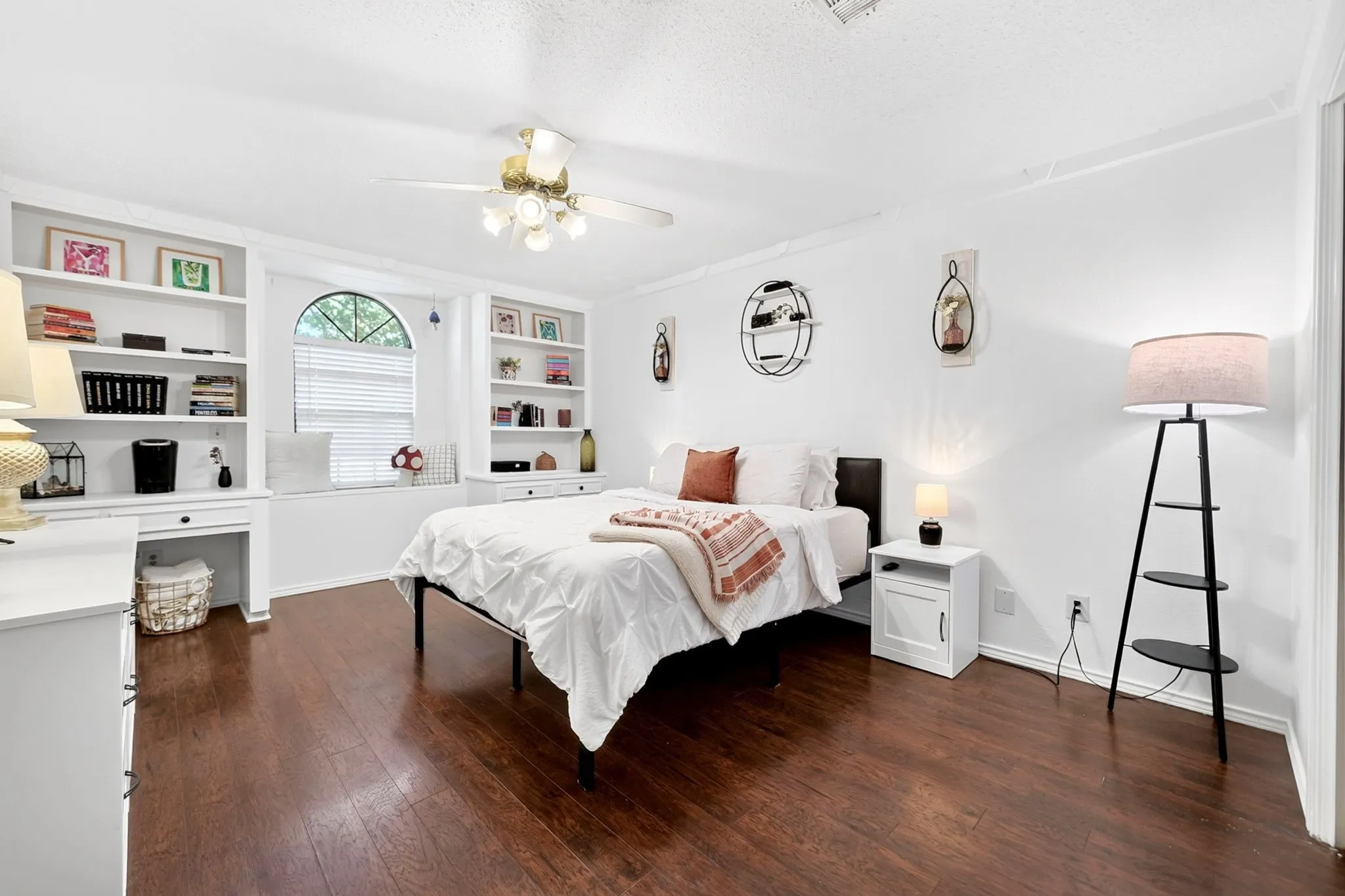 Built-ins make for the perfect display area and storage in this bedroom.