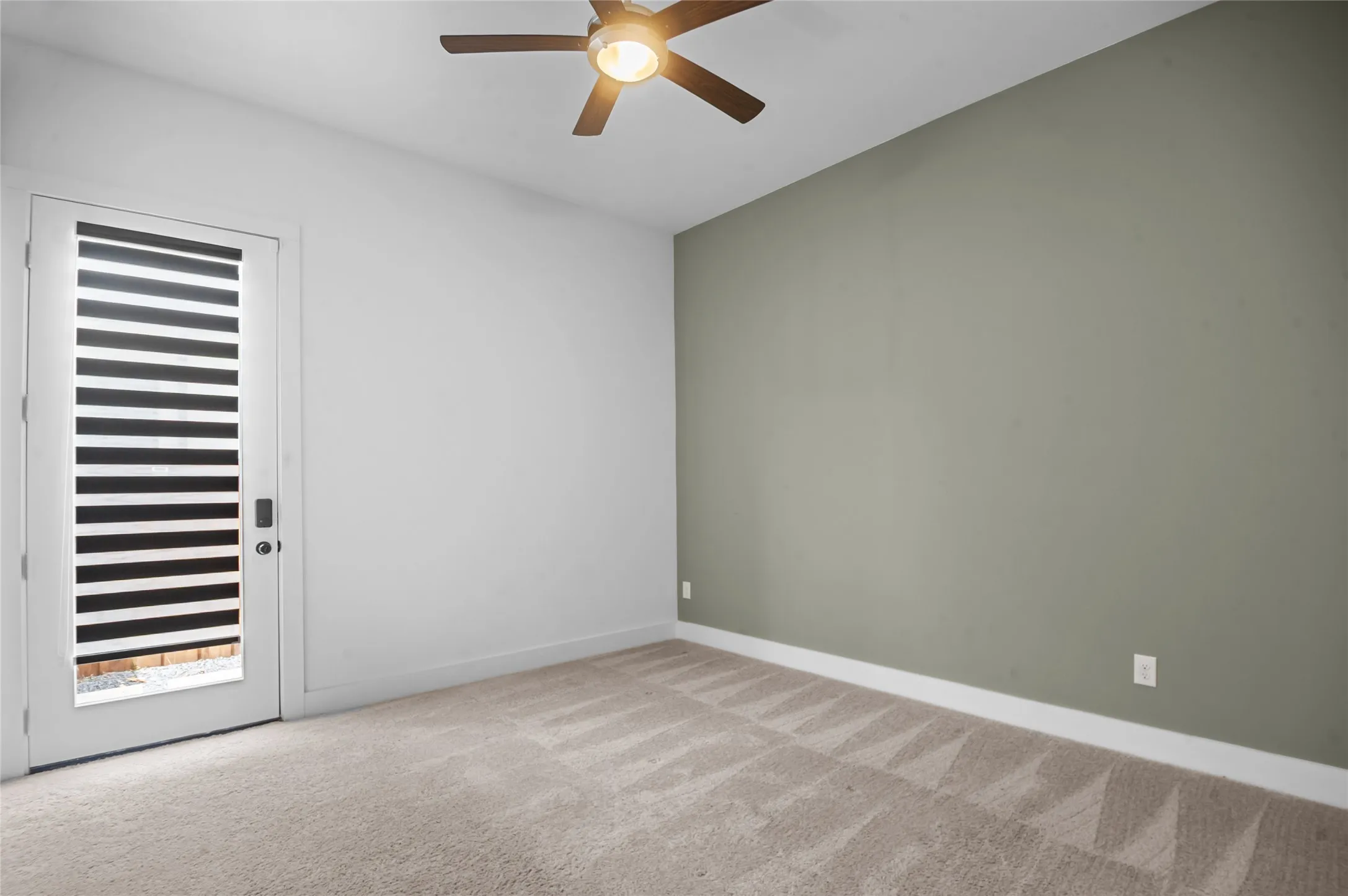 Neutral tone wall and light carpeting