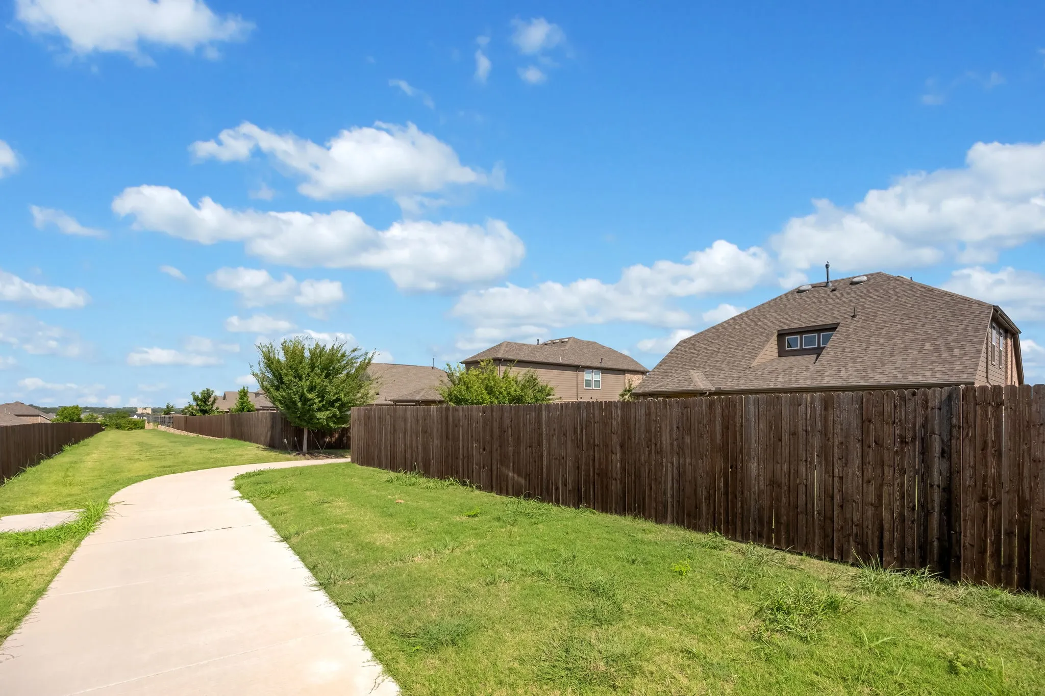 Trail to the right of house