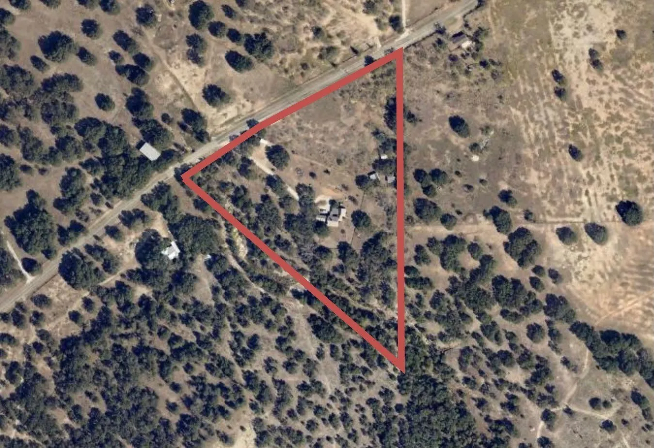 Aerial View. Illustrating the property boundaries and surrounding topography