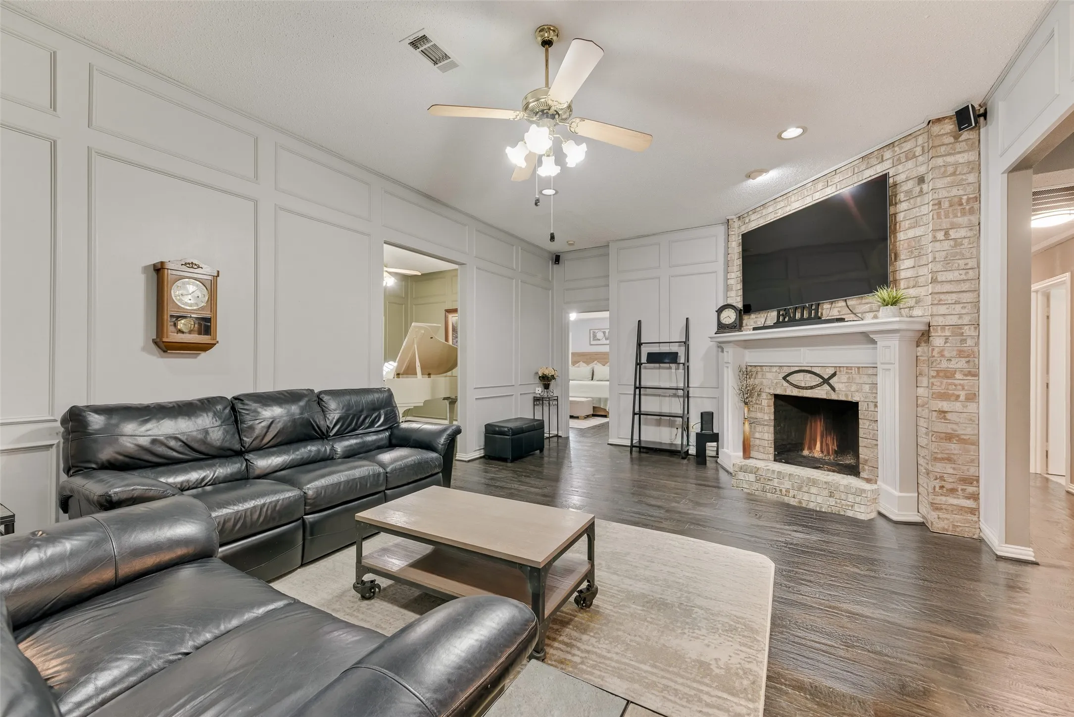 Living Room with real hardwood flooring and gas log fireplace!