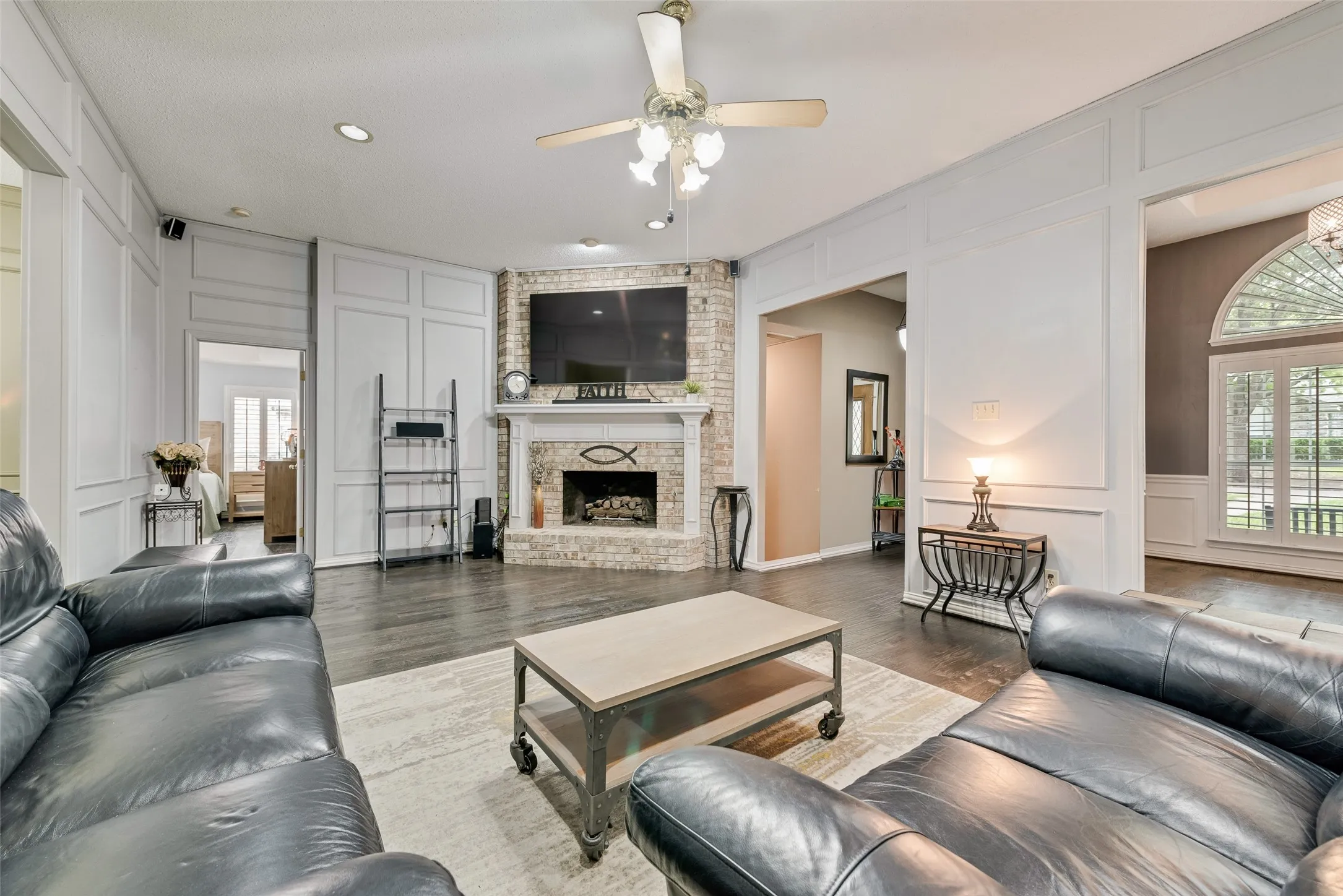 Living Room with real hardwood flooring and gas log fireplace!