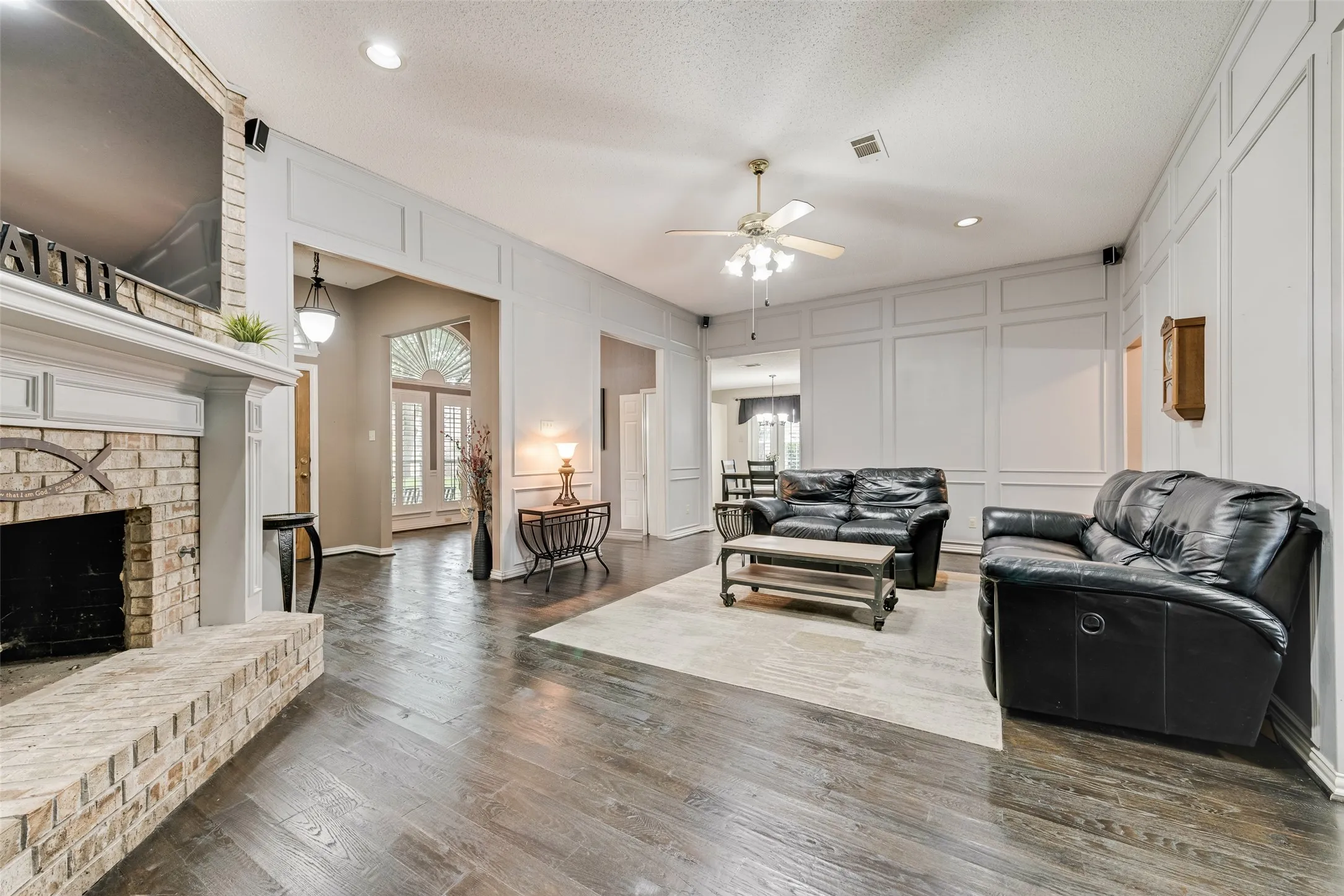 Living Room with real hardwood flooring and gas log fireplace!