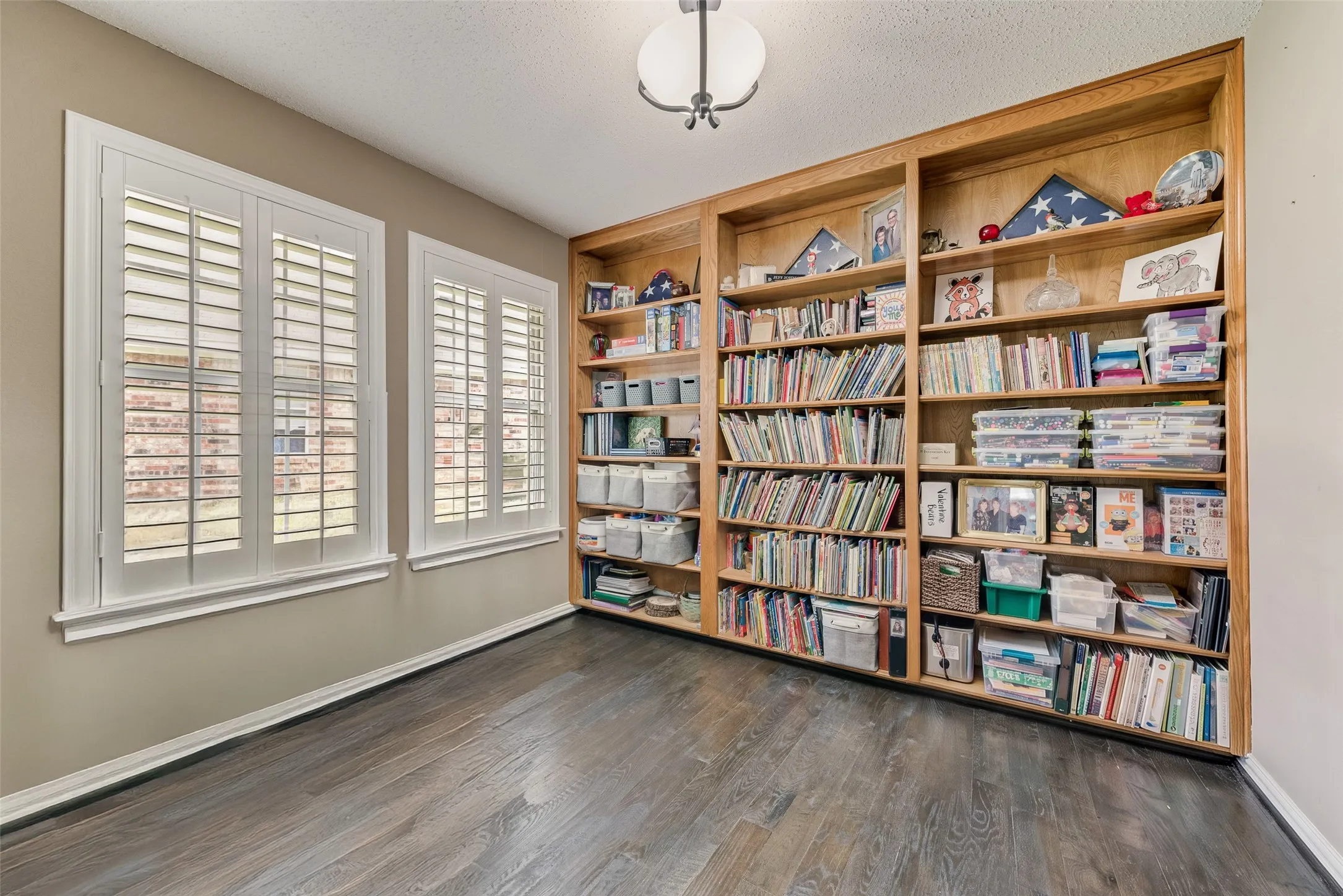 Dedicated Study with Built-in Bookshelves and real hardwood flooring!