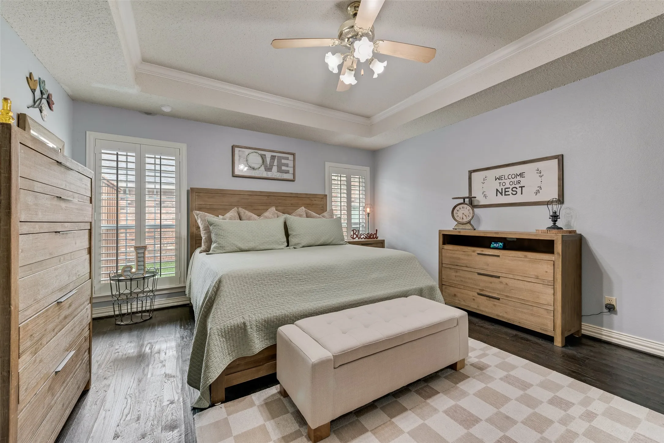 Updated primary bedroom with real hardwood flooring and barn door to ensuite!