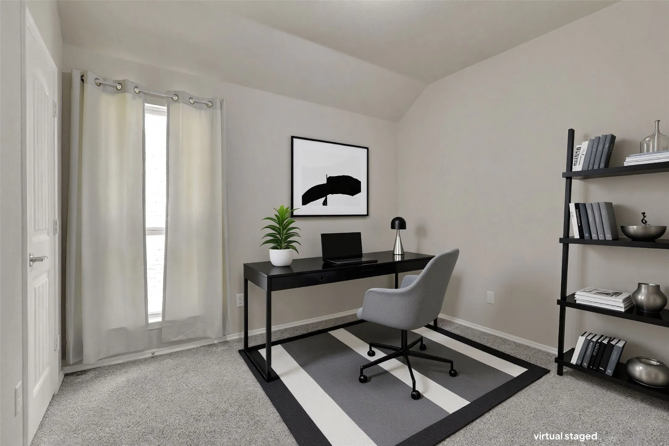 Carpeted room featuring a window with natural light, a door with a polished chrome handle, and neutral-toned walls