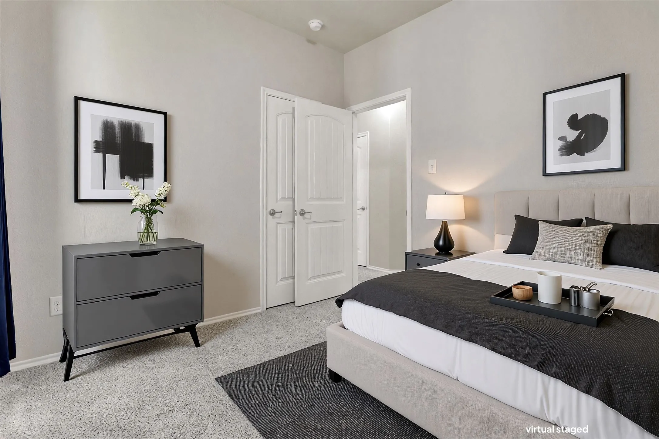 Neutral-toned walls complement the light-colored carpet flooring