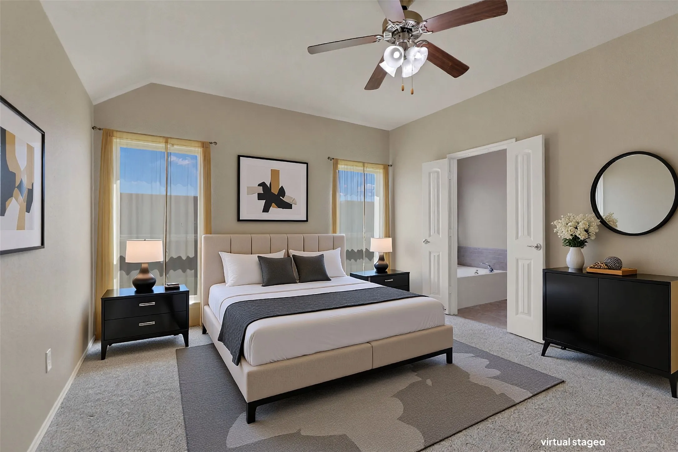 Vaulted ceilings complement the neutral wall tones and carpeted flooring