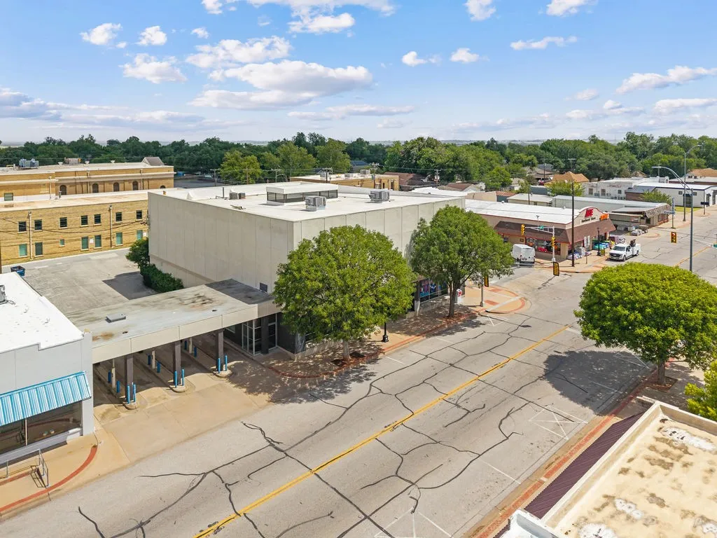 Commercial building featuring a flat roof and light-toned facade