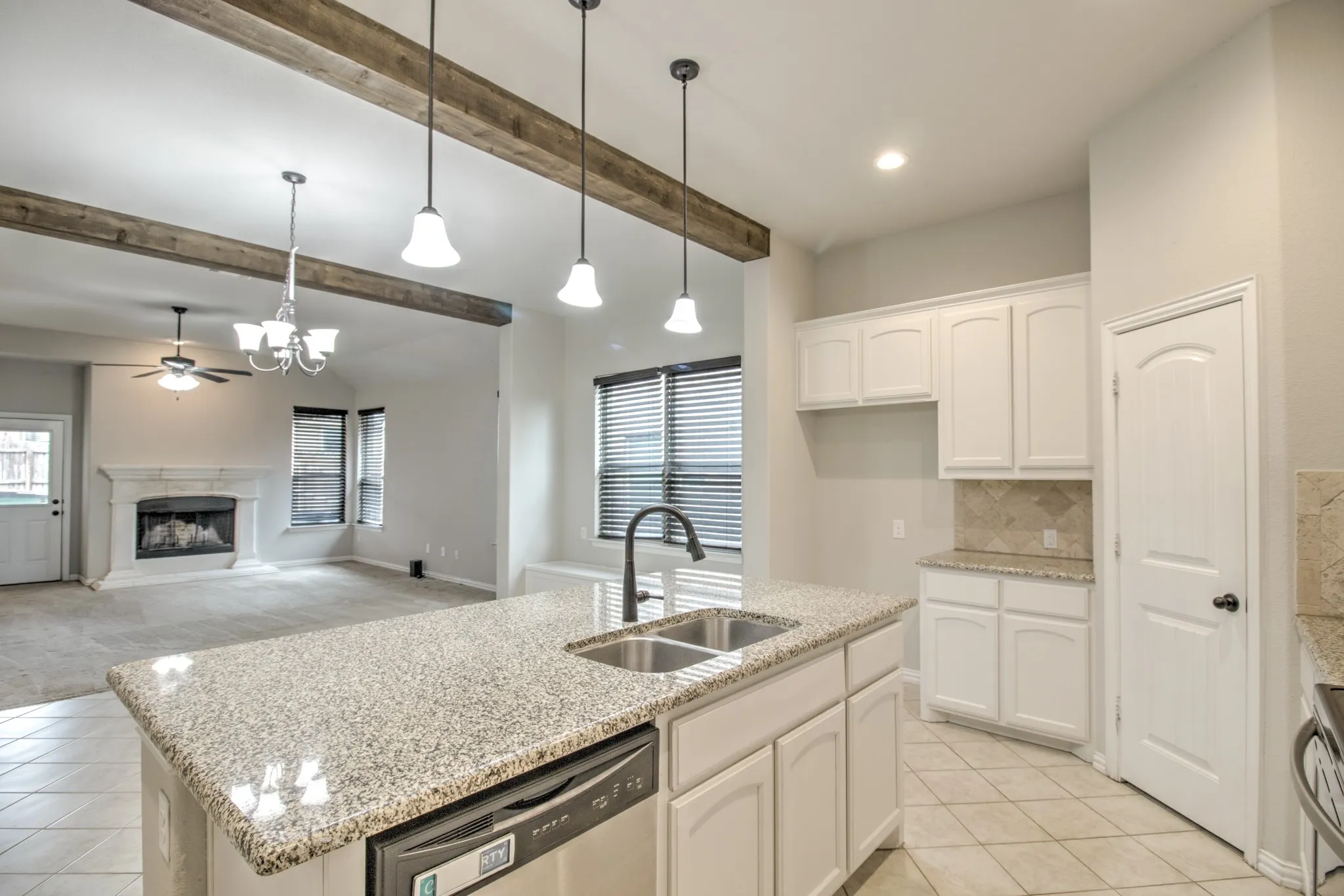 Kitchen island with granite countertop and dual basin sink