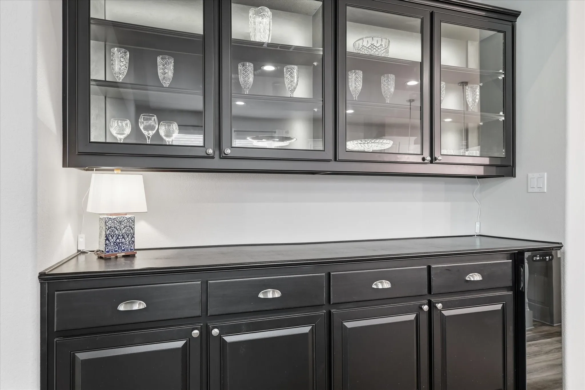 Lighted cabinets, entertaining dream, wine storage.
