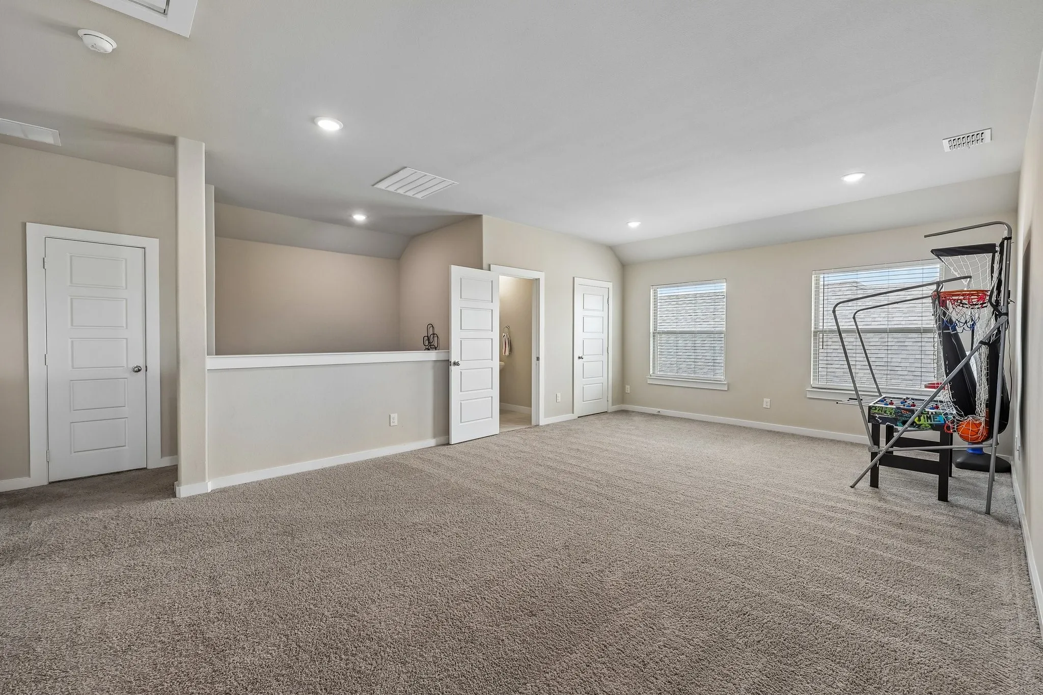 Second floor game room with half bath.