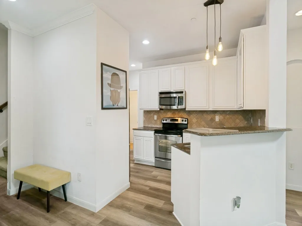open kitchen to living and dining areas
