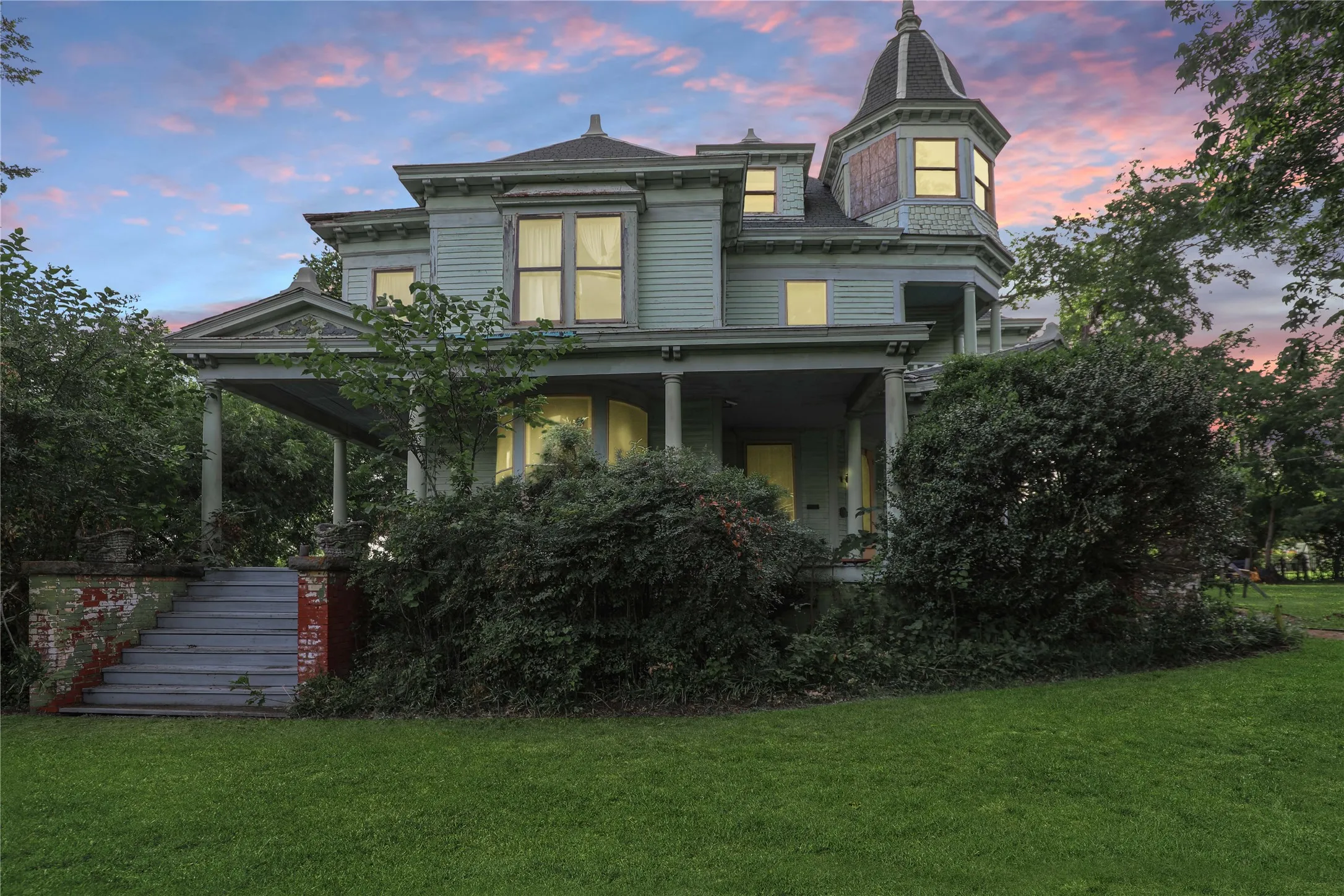 Victorian-style residence featuring a prominent turret and a covered front porch