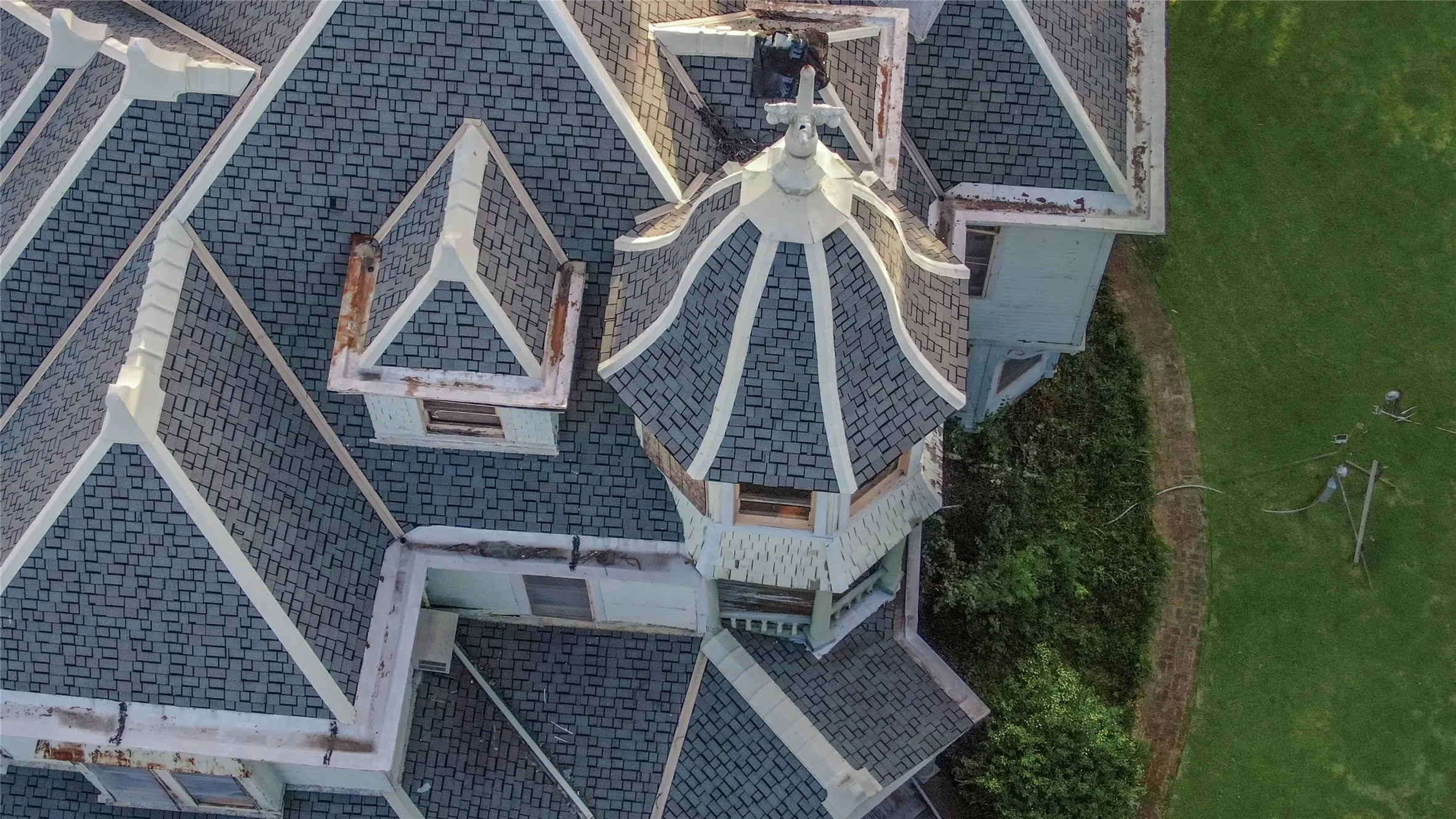 Historic architecture featuring a distinctive turret with a domed roof and decorative finial