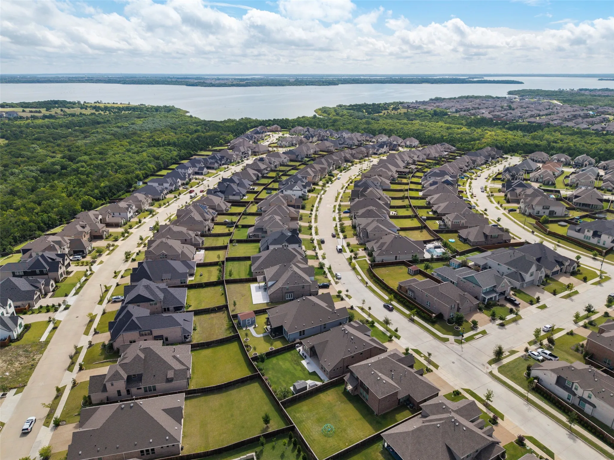 Expansive residential development featuring numerous single-family homes with diverse architectural styles