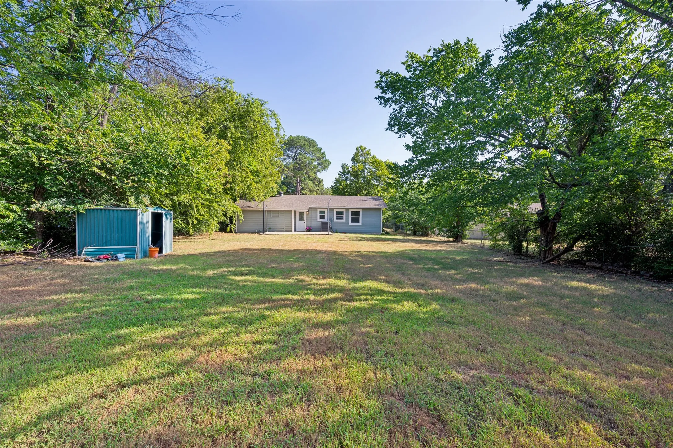 Wow...large backyard has privacy and is fully fenced.