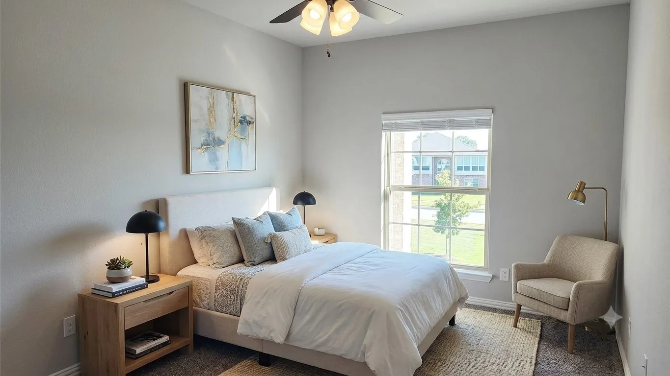 Neutral-toned room featuring a single window with blinds, a ceiling fan with light fixture, and light gray wall​​‌​​​​‌​​‌‌​‌‌​​​‌‌​‌​‌​‌​​​‌​​ paint