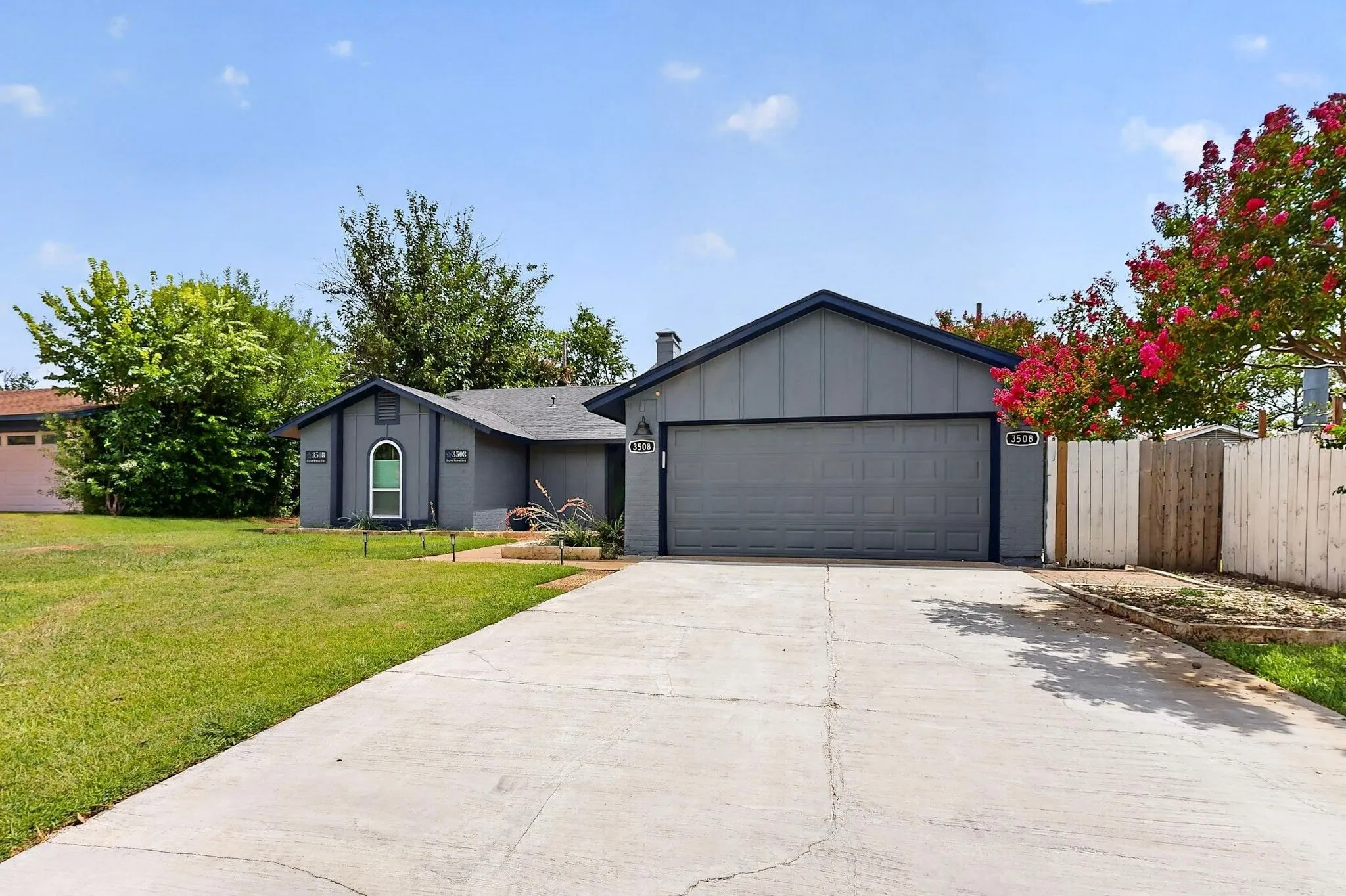Gray exterior with dark trim and a prominent two-car garage