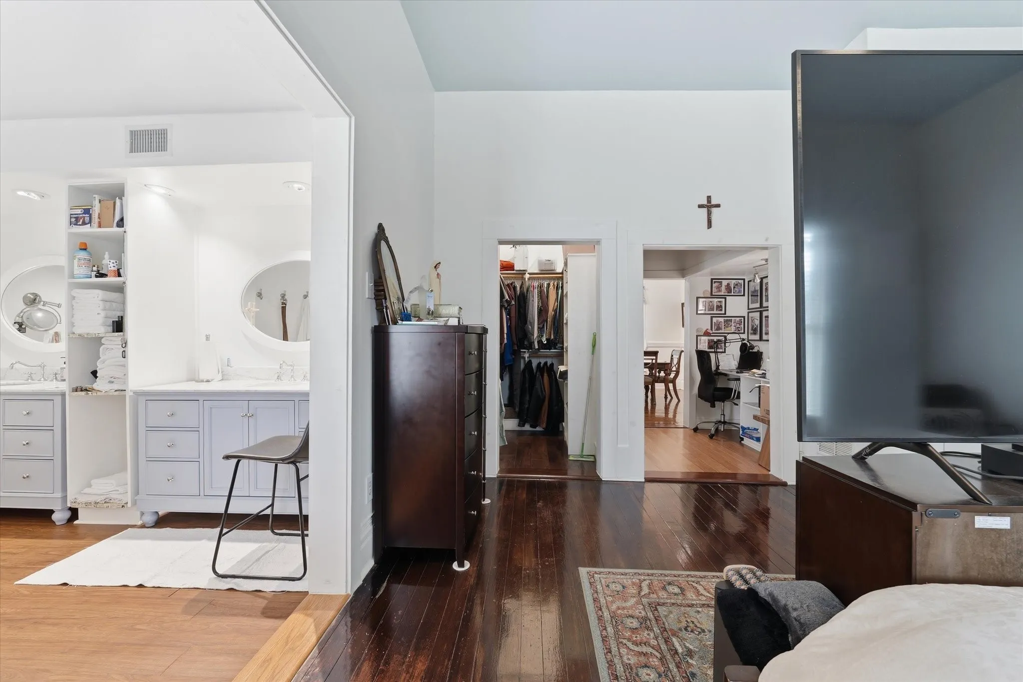 Spacious interior featuring dark wood-finish flooring, high ceilings, and a light-toned color palette