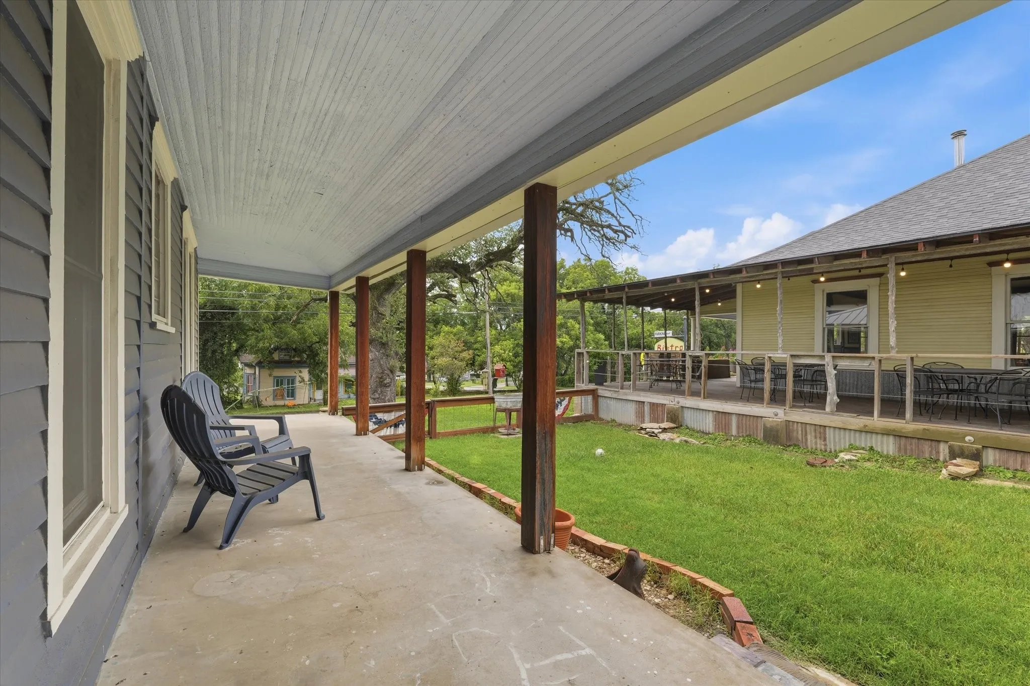 Covered side porch with a beadboard ceiling