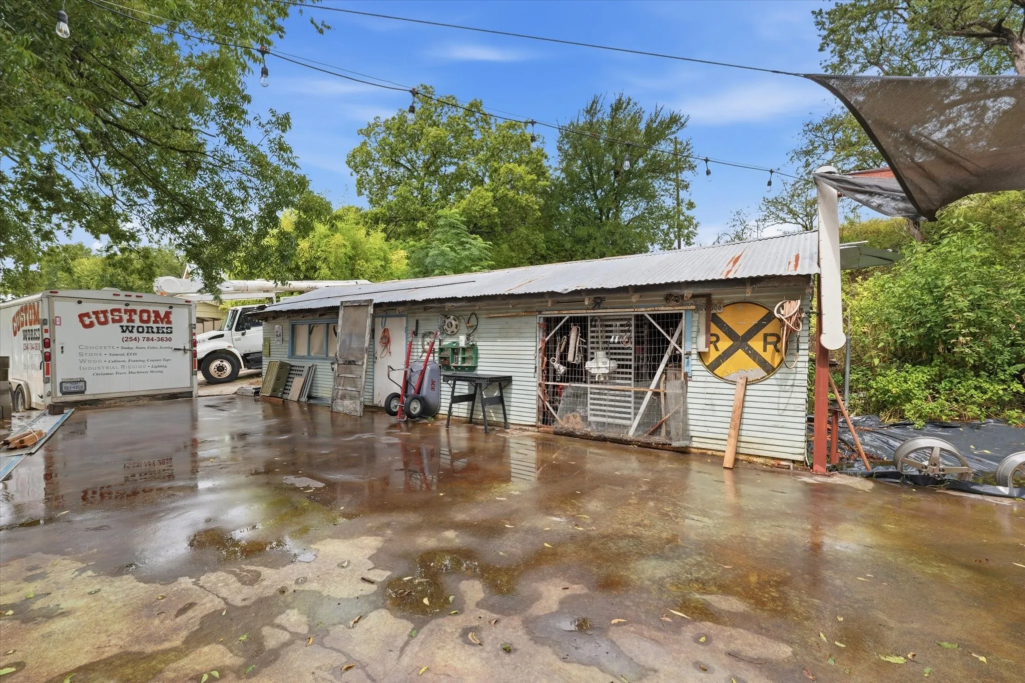 Workshop with freshly poured concrete workspace and veranda