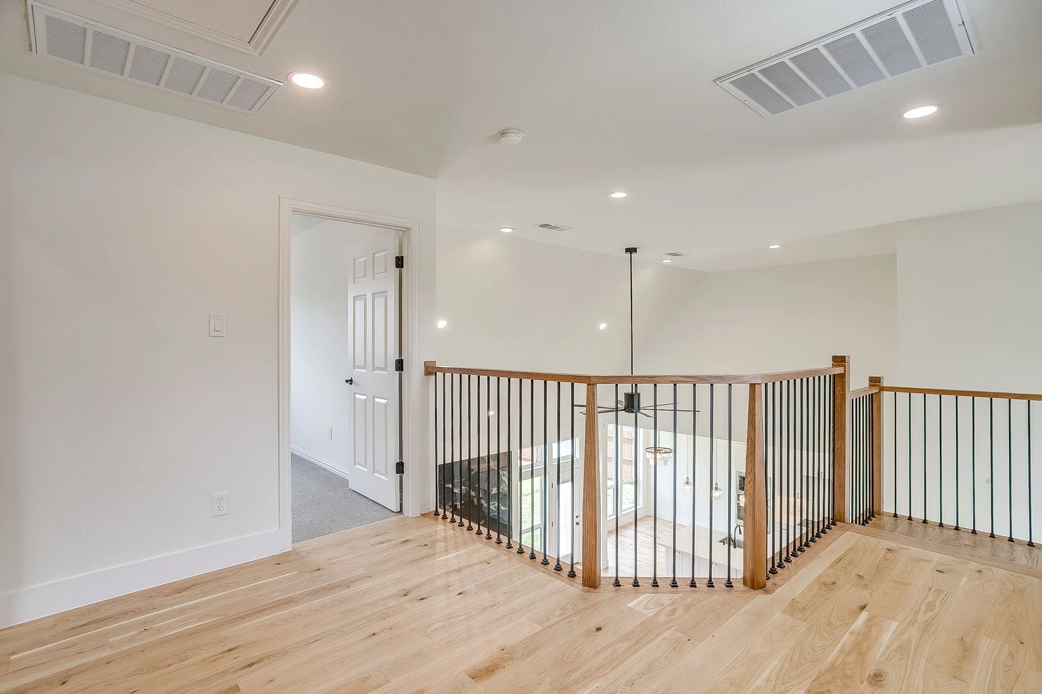 Landing above stairs overlooking living room.