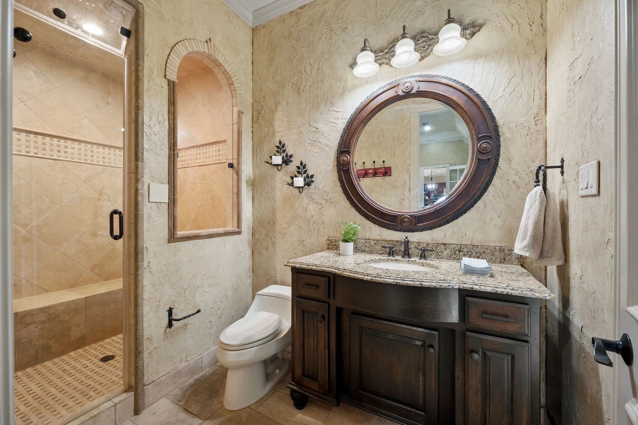 Downstairs full bath with direct pool access and a steam shower.