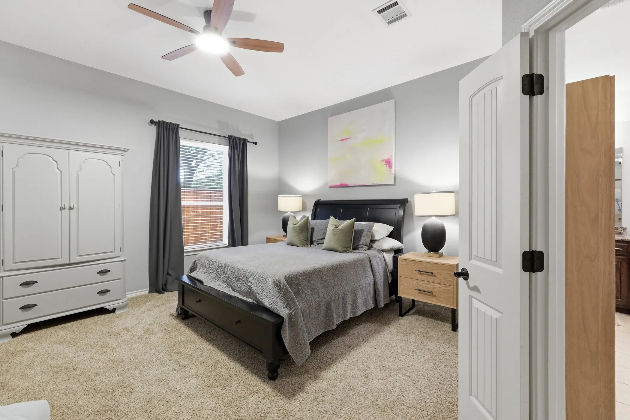 Oversized primary bedroom with fireplace.
