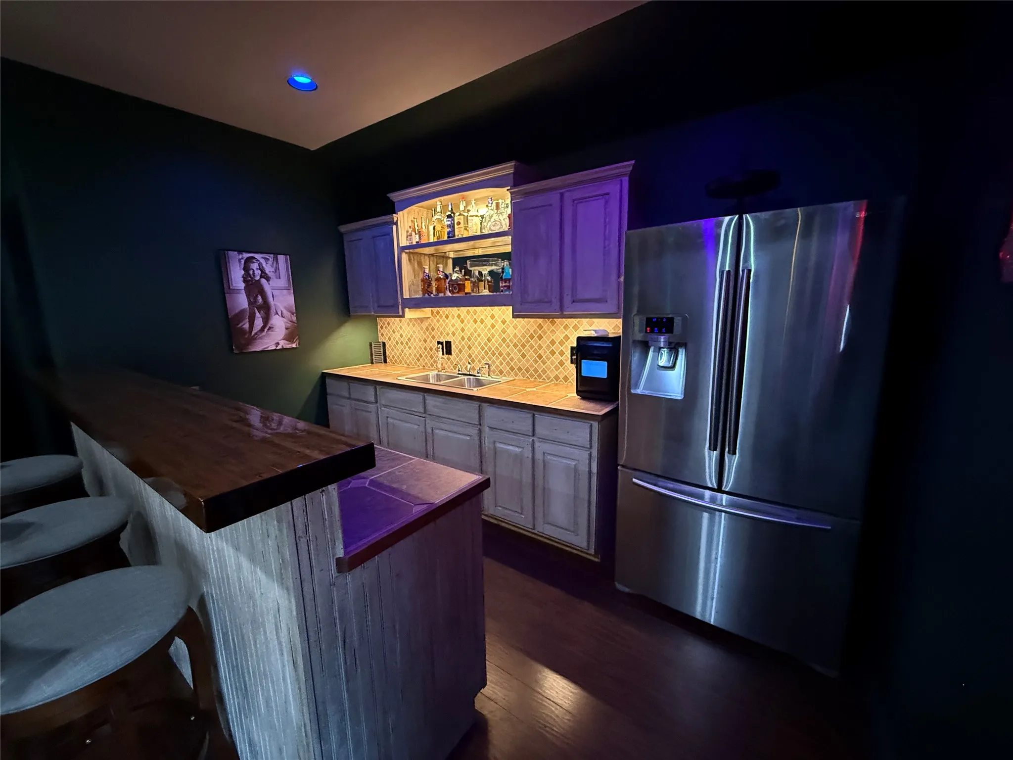 Accent lighting in bar!  Guess what's behind the Rita Hayworth poster?  A safe!  Reminiscent of a movie you may know?