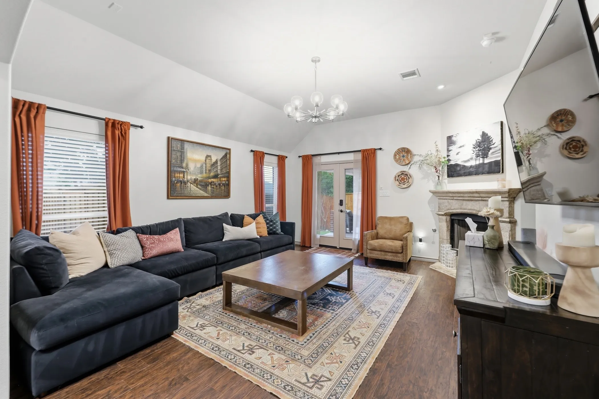 Open living room with backyard and sideyard views.