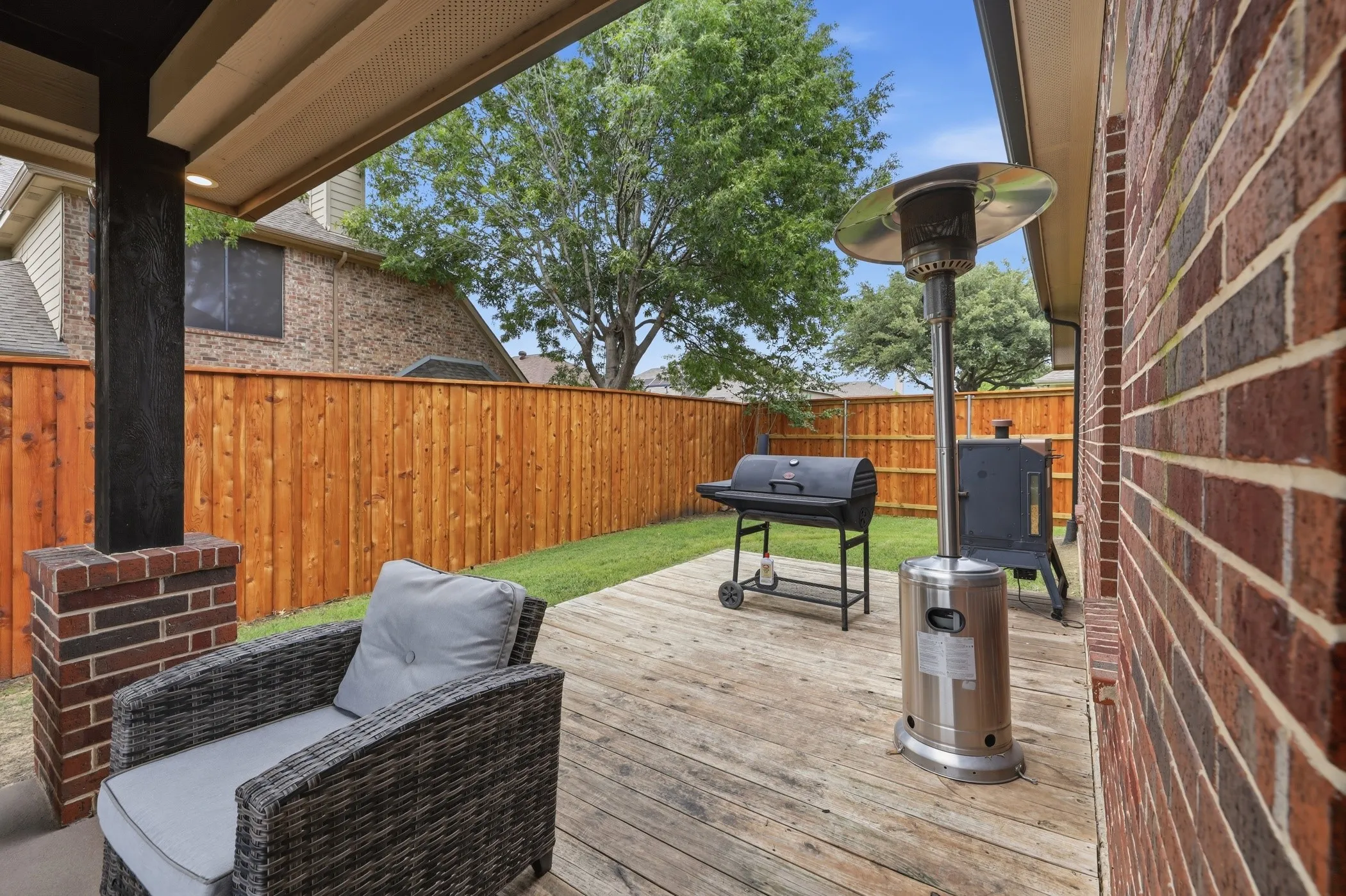 Covered patio leads to deck.