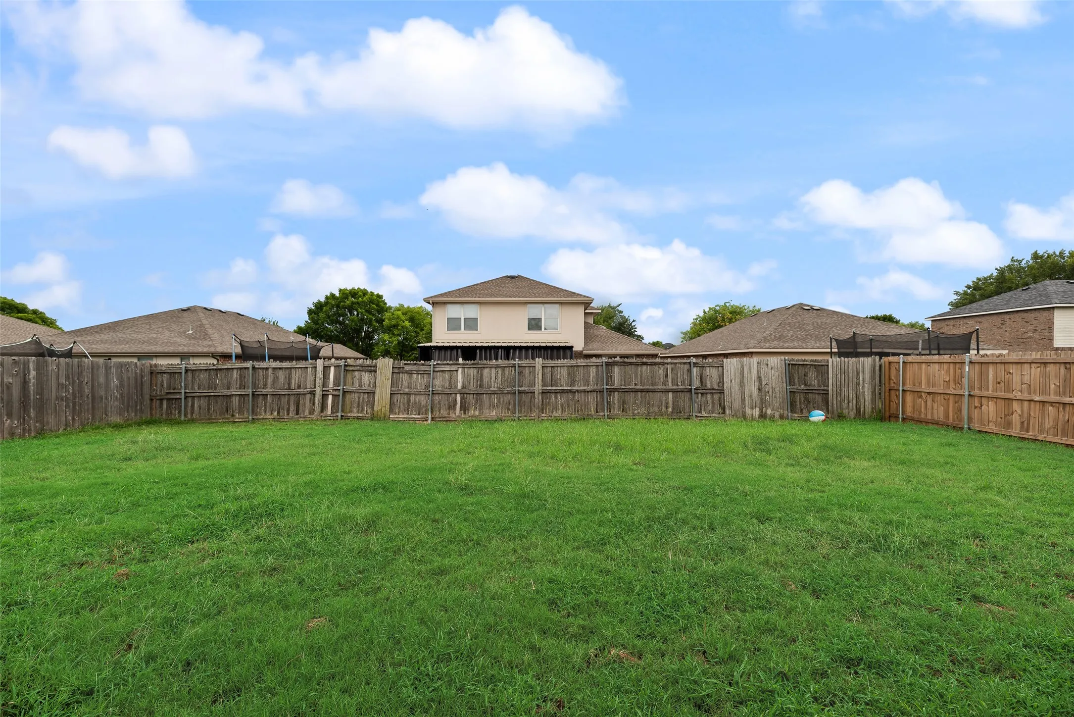 Expansive green lawn providing ample outdoor space