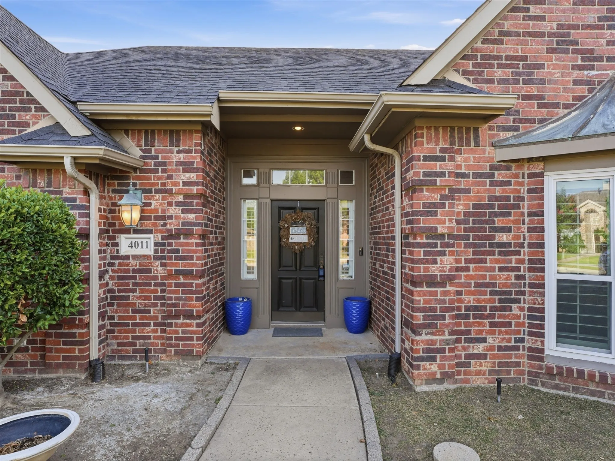 Brick exterior with a dark roof and light trim
