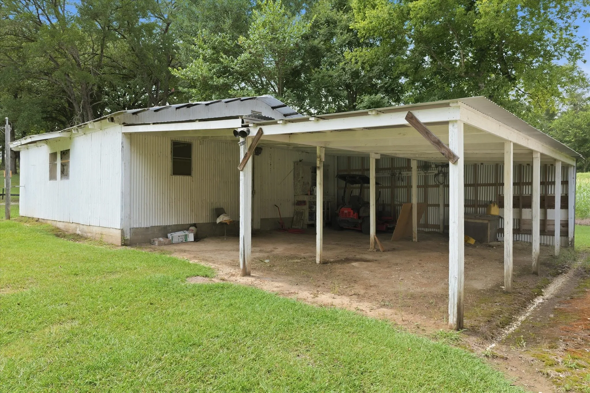 Covered parking attached to workshop