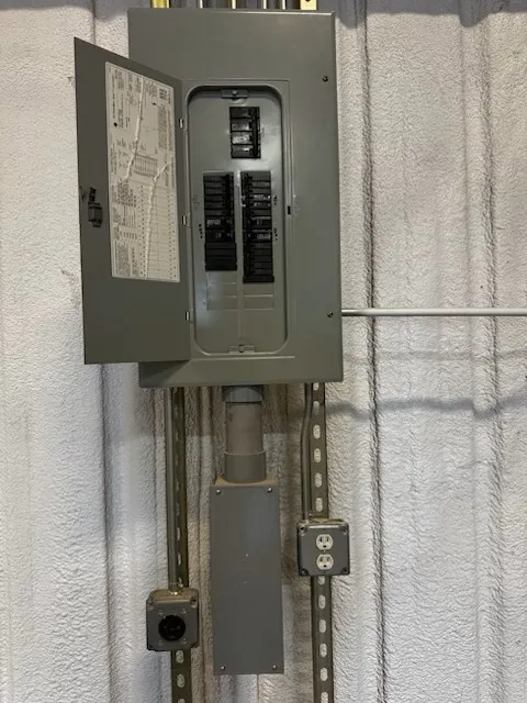 Electrical panel with exposed circuit breakers