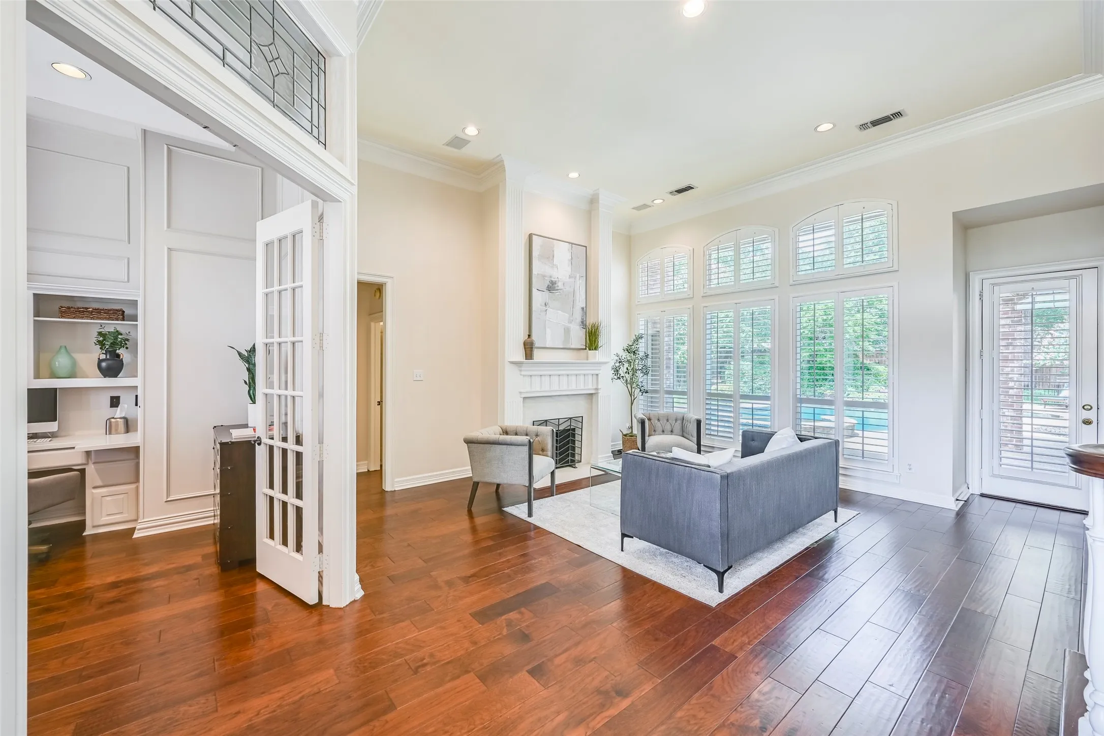 Living room with beautiful view of back yard as you enter the home.