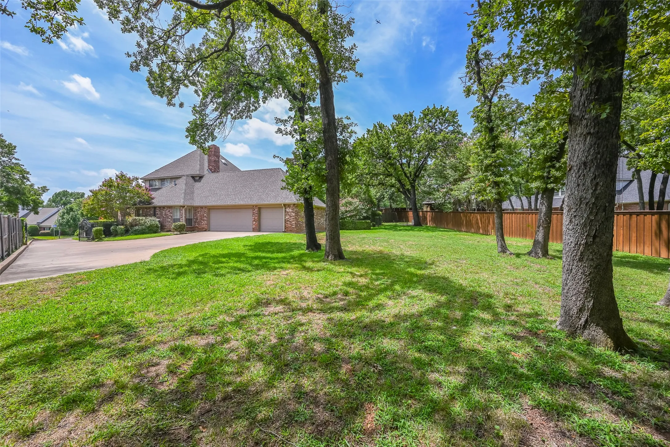 This spacious, grassy backyard is the perfect space for play, leisure, and parties!