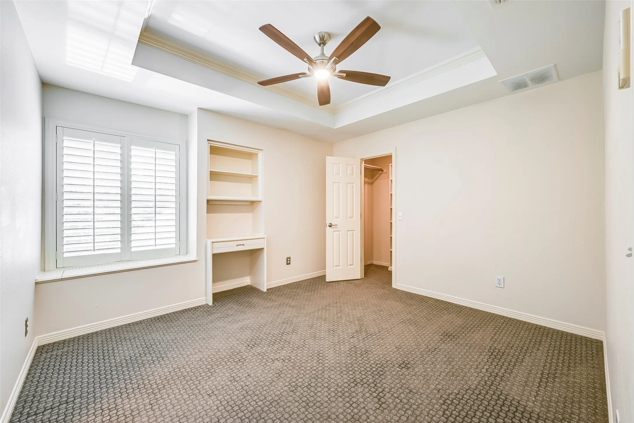 Upstairs bedroom #2 with window seat and built-in desk/shelving