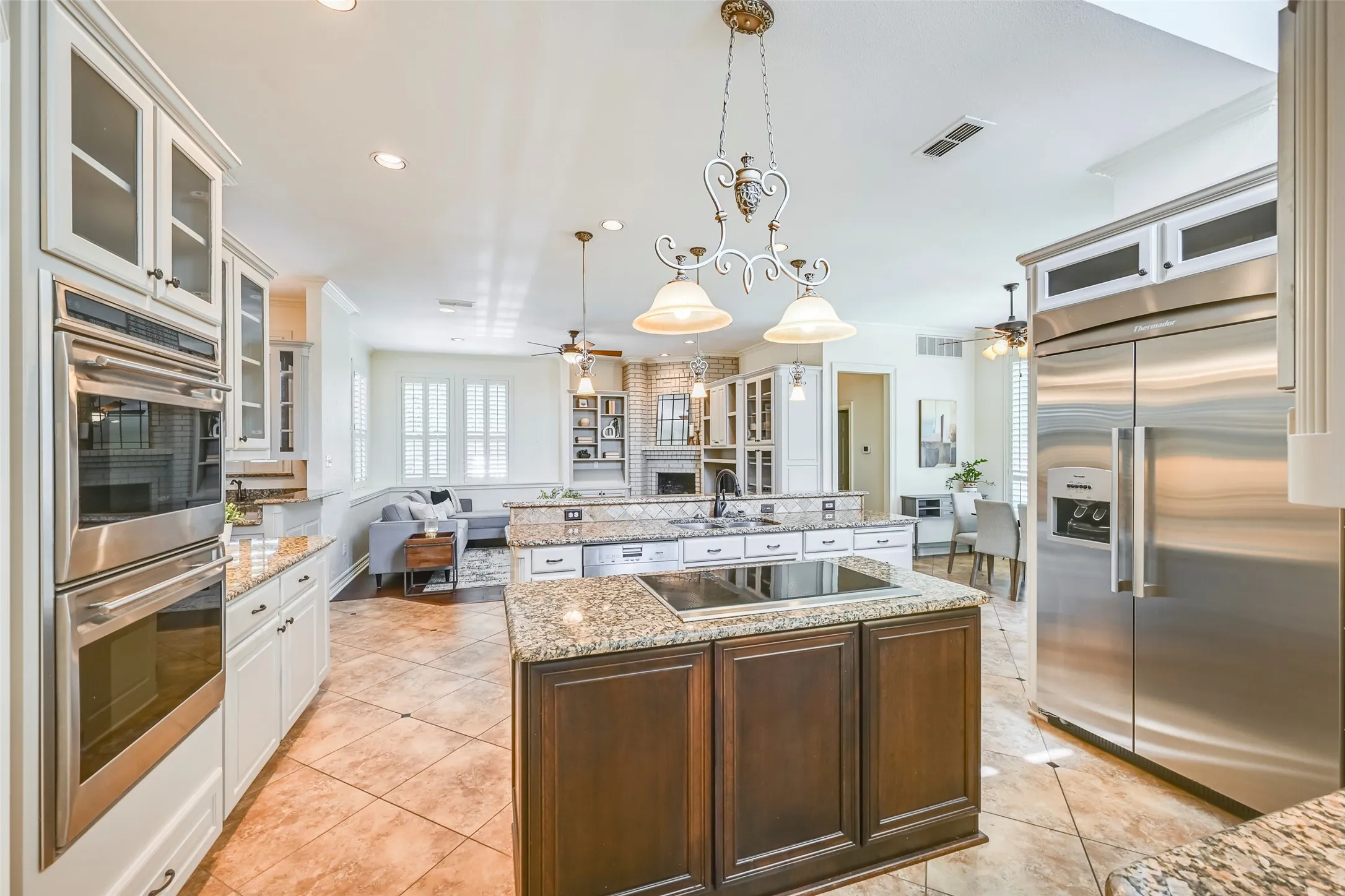 The kitchen area is the heart of this home! Wolf, Thermador, and Miele appliances & walk-in pantry.