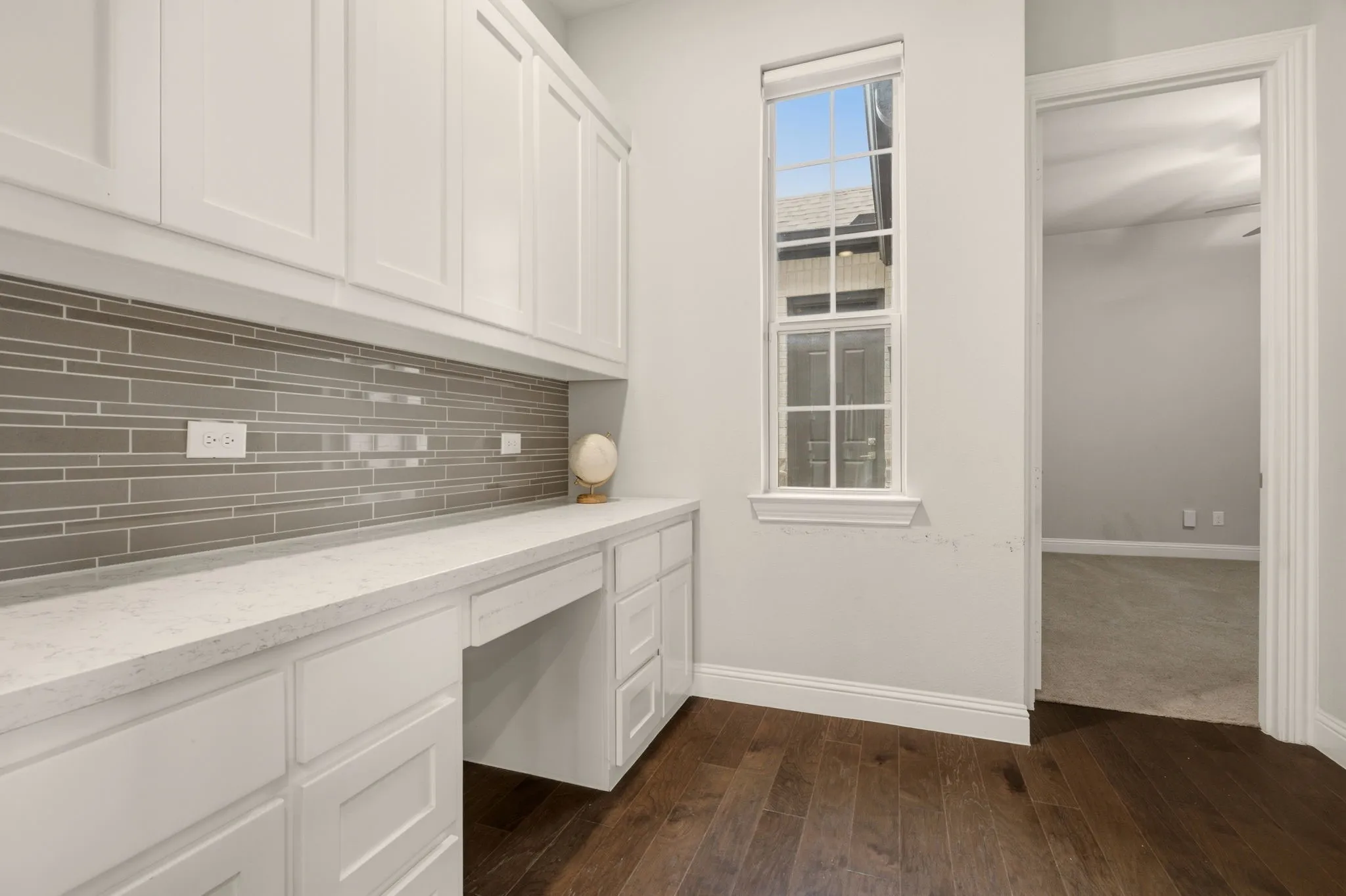 Built in Desk and Cabinetry next to Kitchen.
